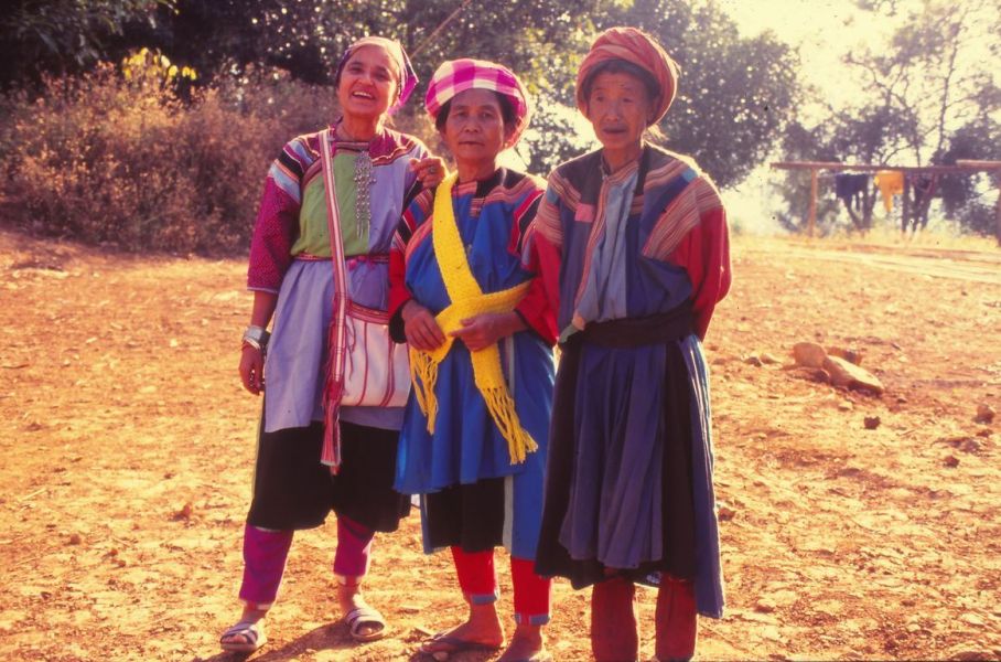 Two Lisu women standing next to Dr. Otome Klein. They are all wearing Lisu costumes EFEO_KLEO00004