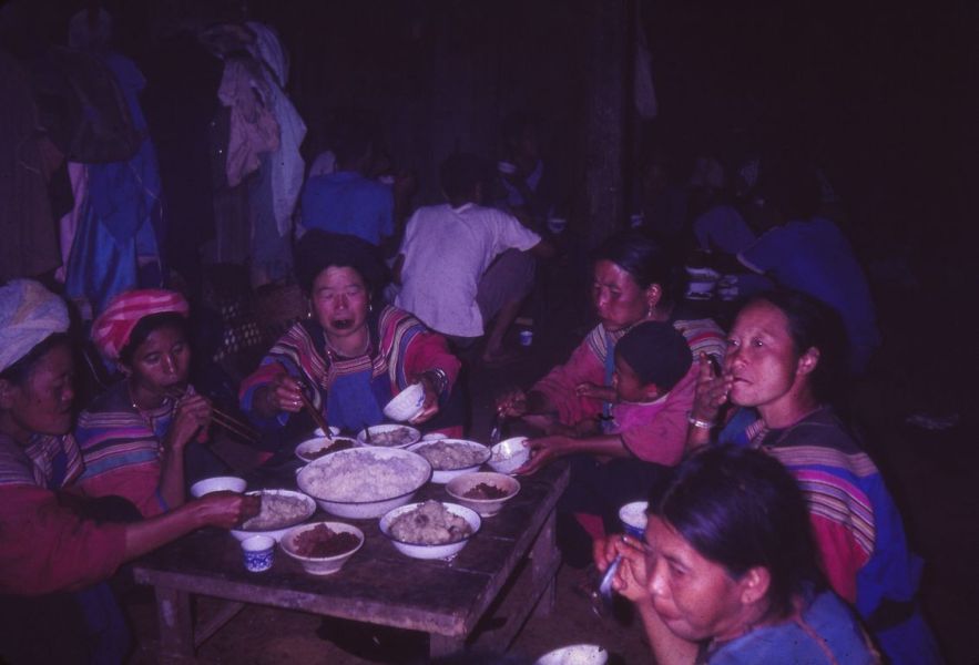 A group of Lisu women is having a meal at the " introduction of the upcoming wife" ceremony EFEO_KLEO00053