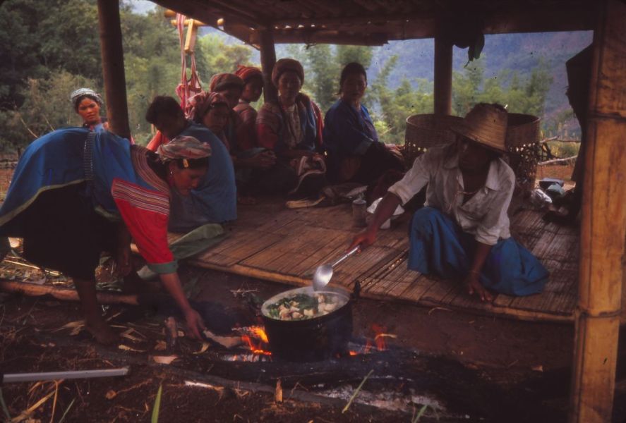 Lisu people are sitting in the field hut, some are cooking. EFEO_KLEO00145